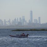 Hydroplane racing boat goes by the Freedom tower